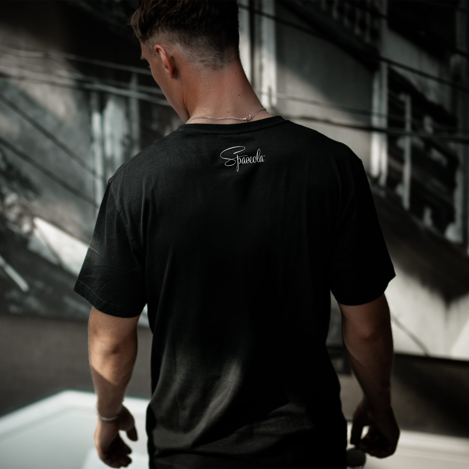 Attractive, high quality black T with Spaceola logo centered on the back