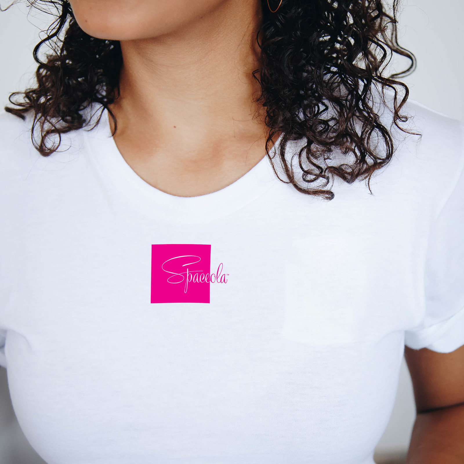 As with all things Spaceola, less is often more with this attractive, high quality white T with magenta Spaceola logo.