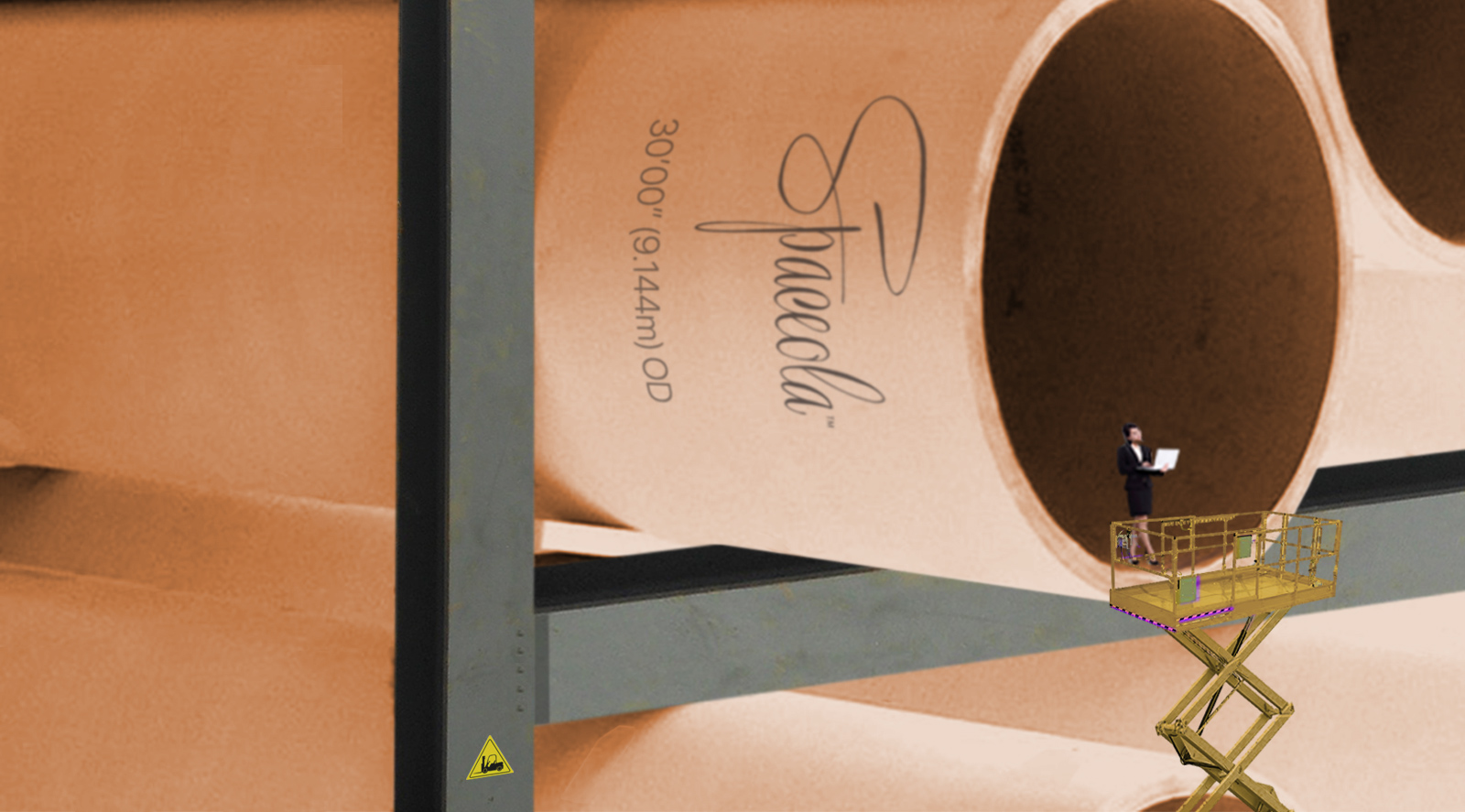 A Spacola engineer checks specifications from within a newly delivered cardboard booster tube.