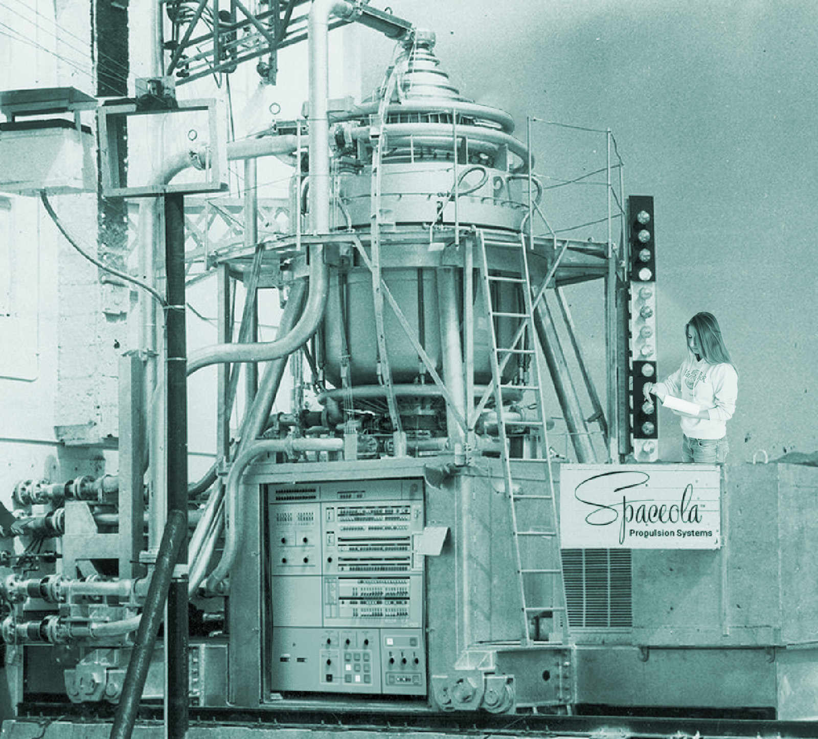A young intern from Florida Tech performs complicated tests on an older rocket engine at the Research Center.